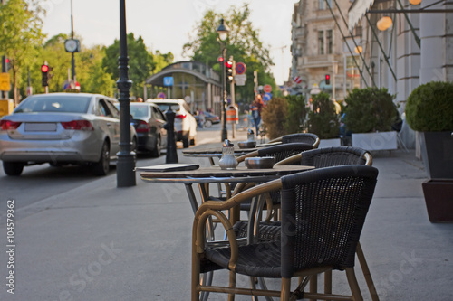 Photography Outdoor cafe. Little tables of cafe on the street of Vienna.