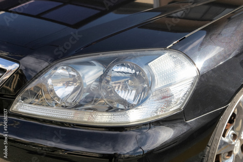 Head lights of a sport car., Front lights of a sport car.
