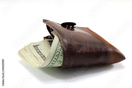 Brown leather wallet with dollars