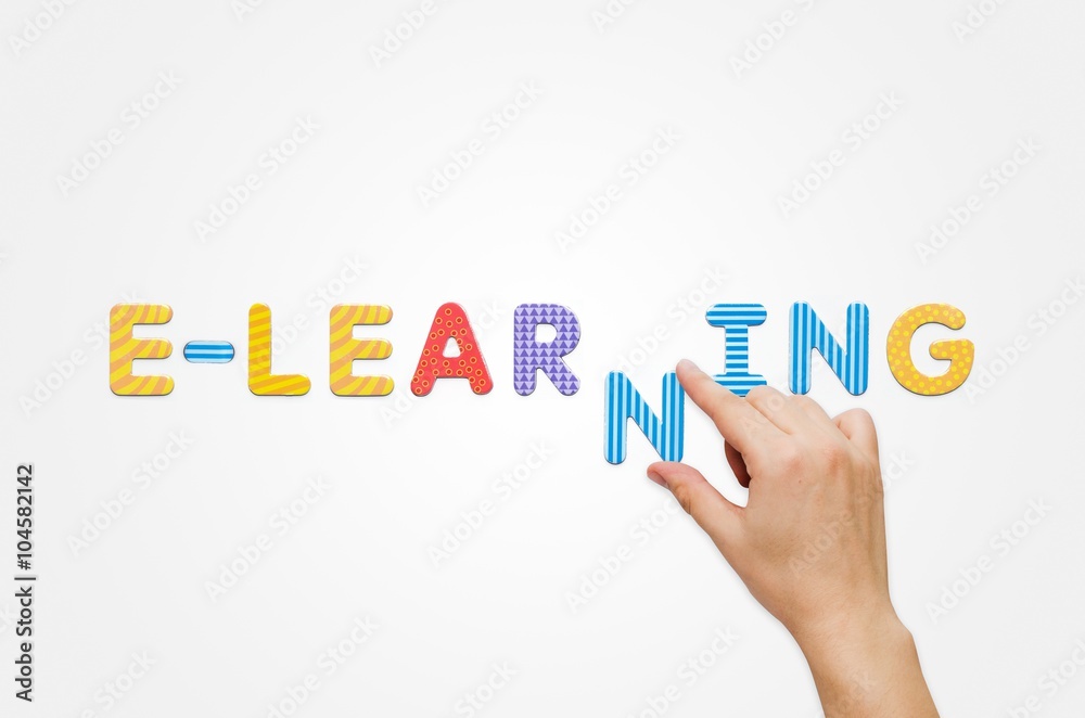 Hand put the word e-learning with magnetic letters Hand put the word e-learning with magnetic letters