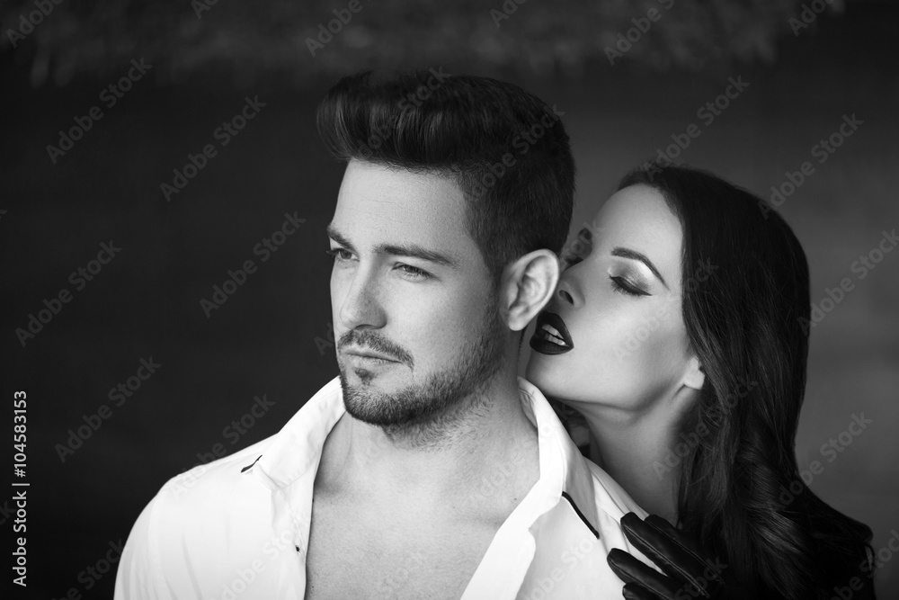 Sexy milf woman whispering macho man black and white Sexy milf woman whispering macho man black and white