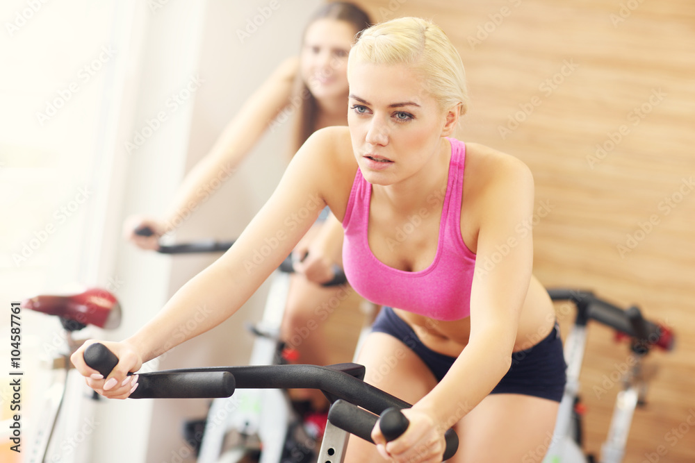 Sporty women on spinning class Sporty women on spinning class