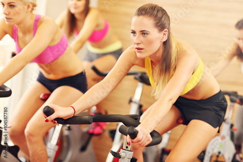 Sporty women on spinning class