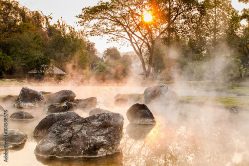 Sunrise behind hot spring