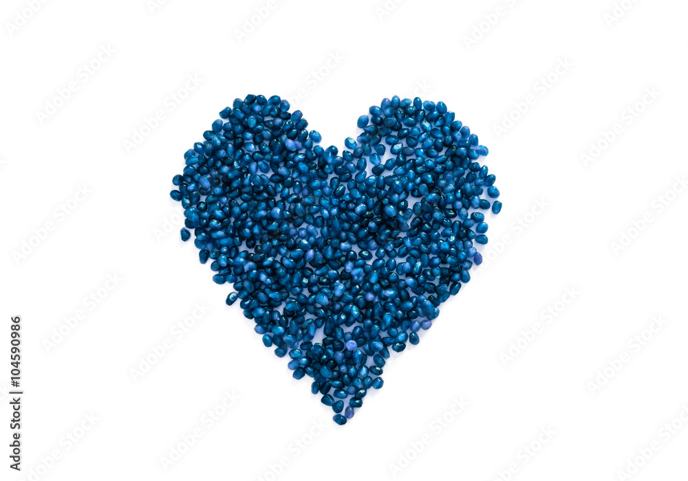 Blue berries of a pomegranate in a heart shape