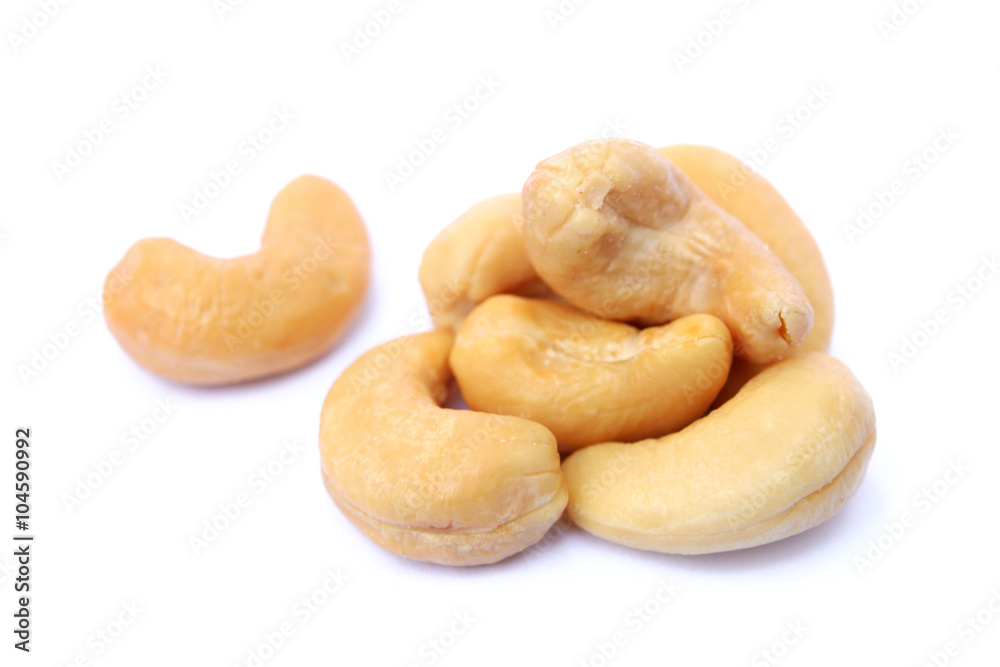 Peeled salted cashews isolated on a white background Peeled salted cashews isolated on a white background