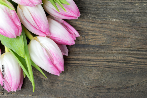 Fototapeta Naklejka Na Ścianę i Meble -  Pink tulips on wooden background.
Copy space.