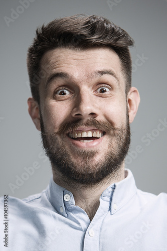 Portrait of young man with shocked facial expression