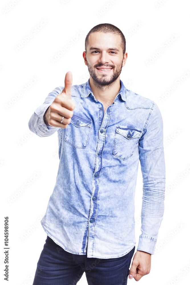 Young casual man thumbs up over white background Young casual man thumbs up over white background