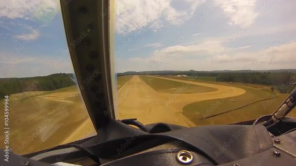 POV shots of a C-130 cargo plane landing on a dirt runway.