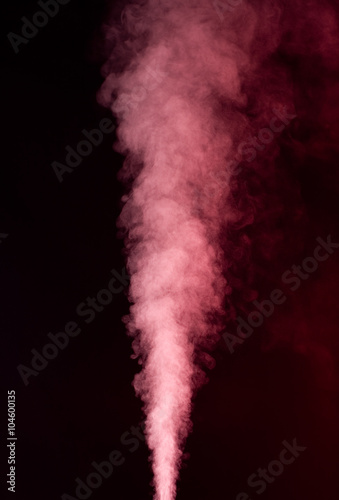 Red vapor on the black background