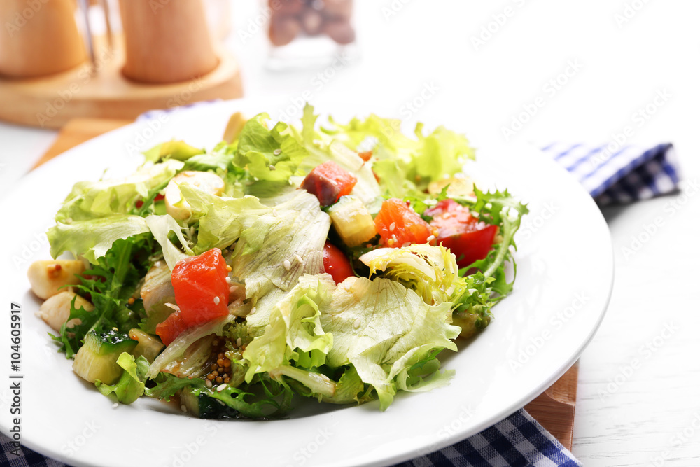 Tasty salmon salad on wooden table background Tasty salmon salad on wooden table background
