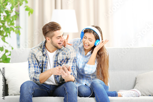 Happy young couple sharing ...