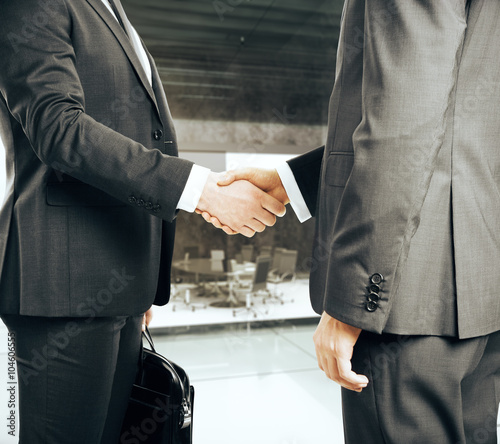 Businessmen shake hands in modern office, 3D Render