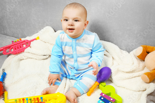 Adorable baby with colourfu...