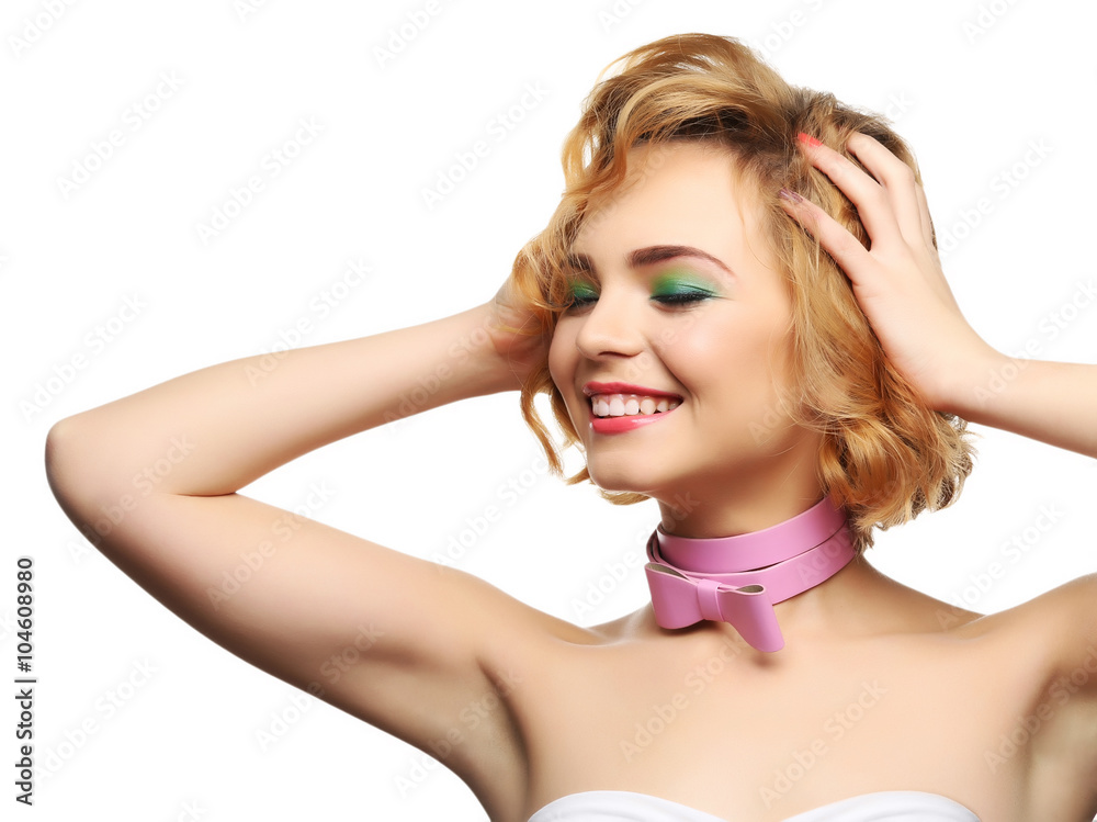 Fototapeta premium Beautiful girl with colorful makeup and pink bow, isolated on white