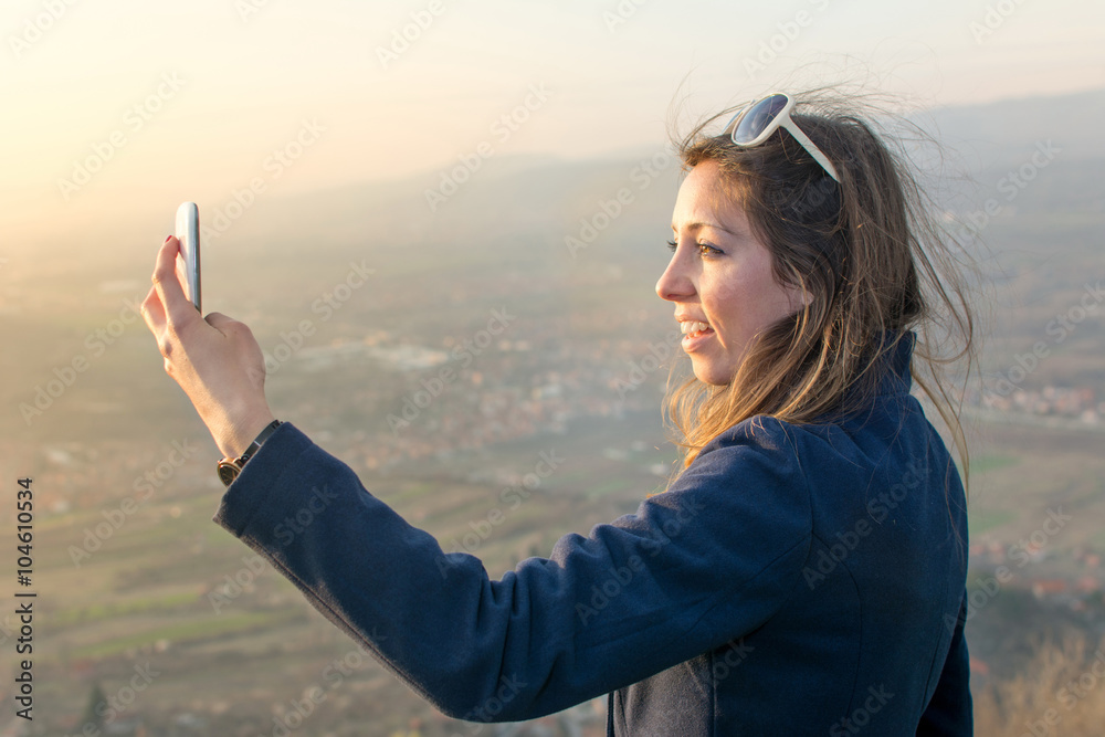 Girl taking a selfie on a hiking trip