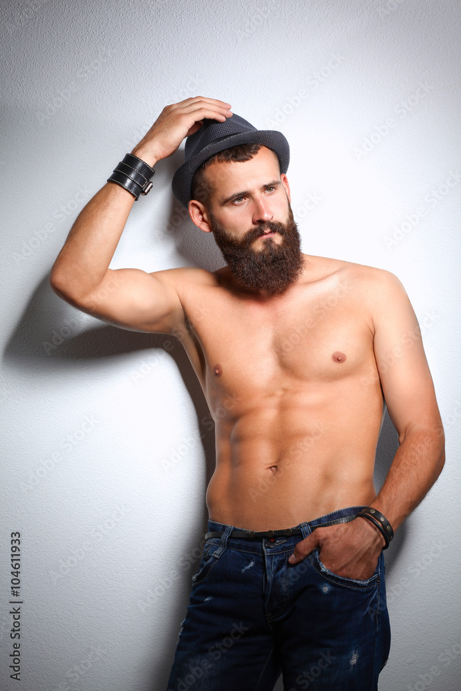Portrait of handsome man standing, isolated on grey background Portrait of handsome man standing, isolated on grey background