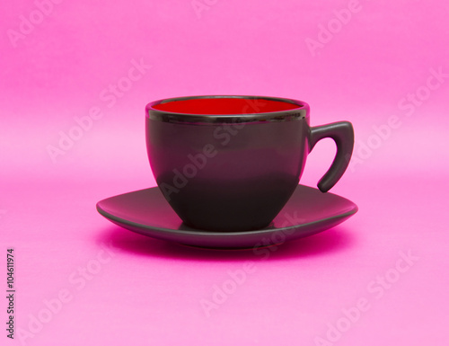 Black cup isolated on pink background