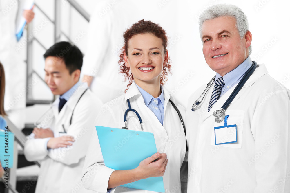 Team of smiling doctors indoors