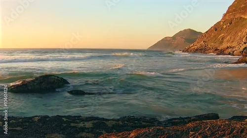 Ocean waves at sunset, Noordhoek Beach in south africa.