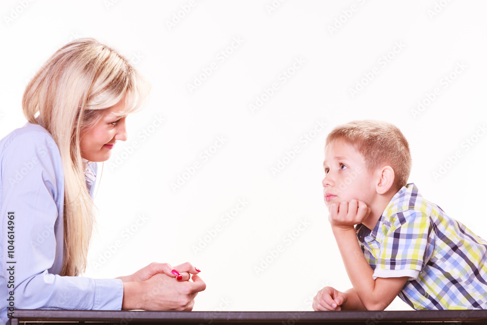 Mother and son talk and argue sit at table. Mother and son talk and argue sit at table.