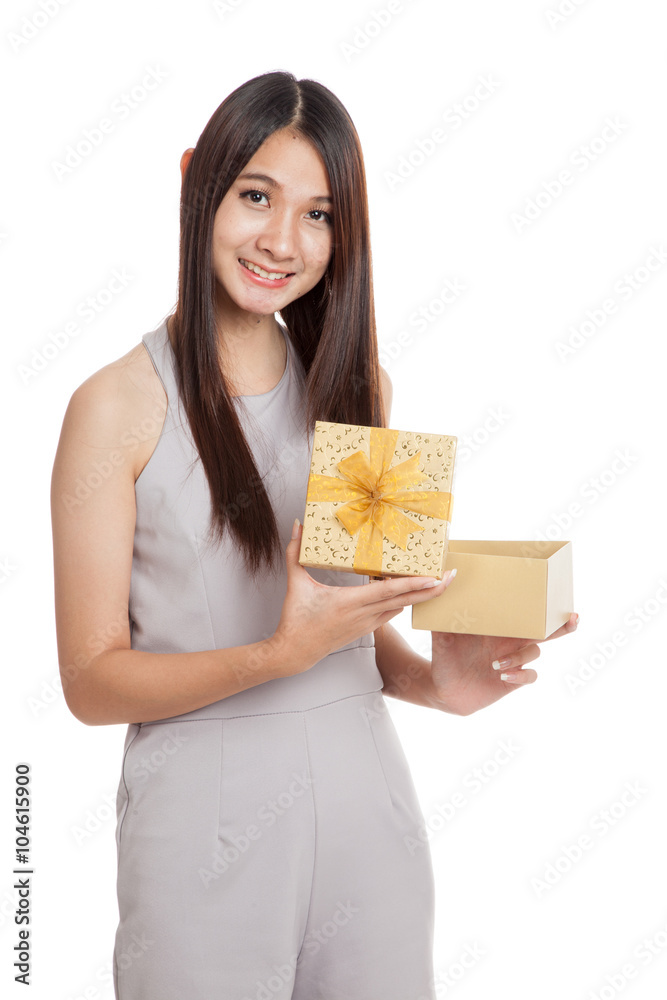 Beautiful young Asian woman with golden gift box Beautiful young Asian woman with golden gift box