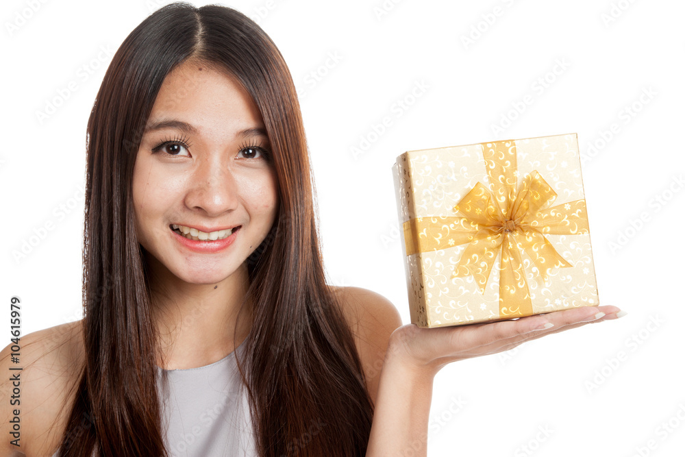Beautiful young Asian woman with golden gift box Beautiful young Asian woman with golden gift box