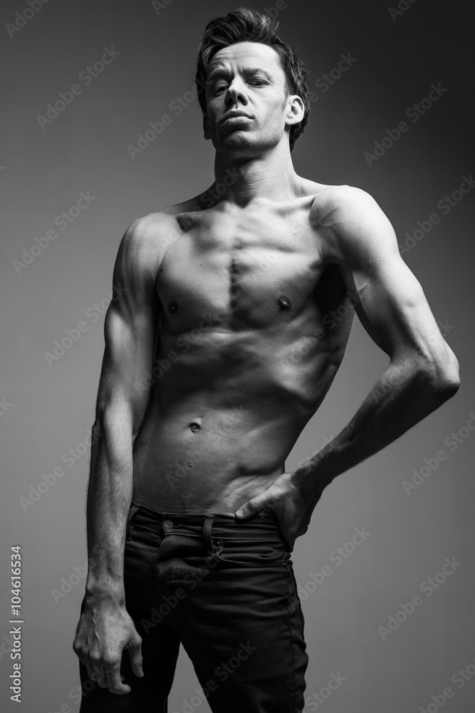 Skinny young man posing fashion, slim body