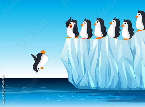 Penguin jumping in the ocean