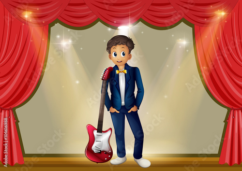 Man with guitar on stage