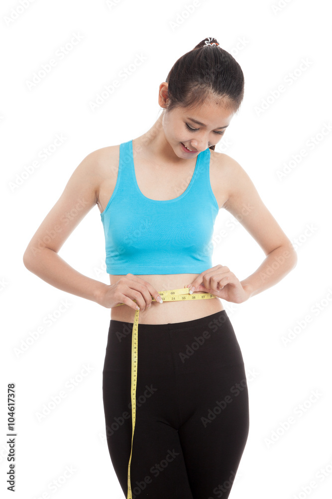 Beautiful Asian healthy girl measuring her waist Beautiful Asian healthy girl measuring her waist