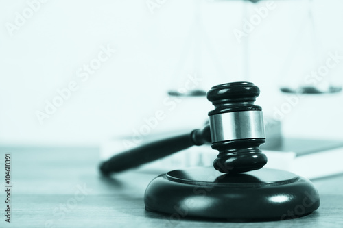 Wooden judges gavel on wooden table  close up. Retro stylization