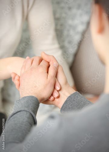 Man and woman holding hands closeup