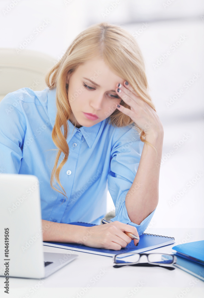 Tired woman at the laptop in office Tired woman at the laptop in office