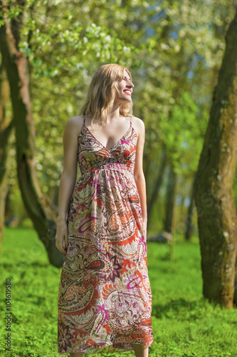 Portrait of Smiling Sensual Blond Woman in Spring Forest Outdoors