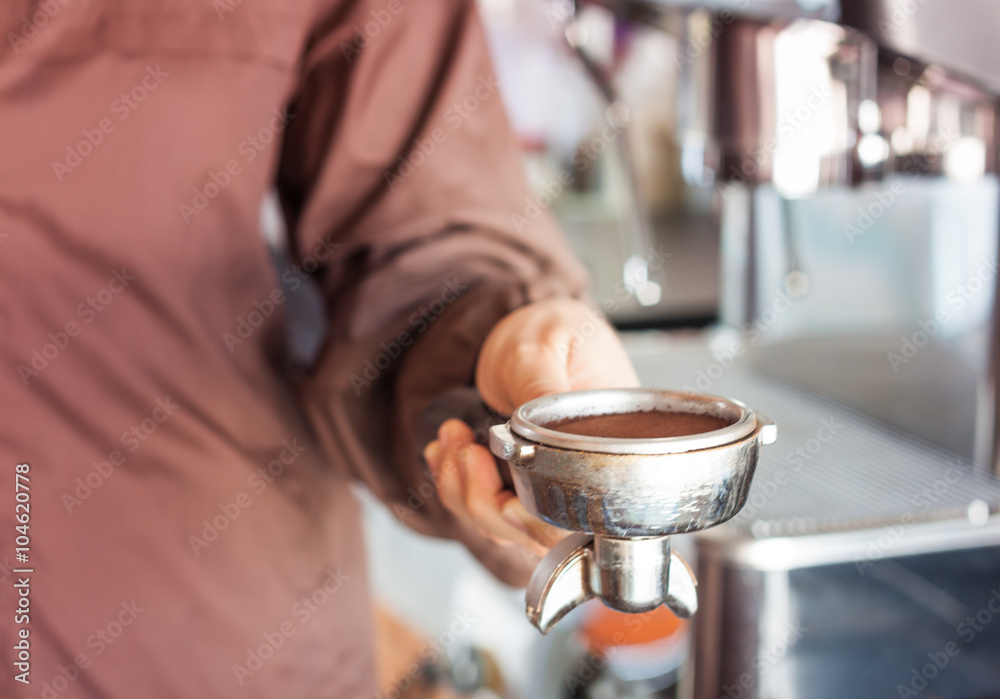Woman's hand holding coffee grind in group with vintage style Woman's hand holding coffee grind in group with vintage style
