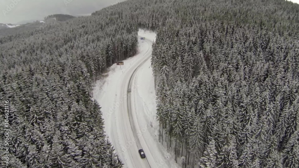 Aerial shot of snow-covered road in the countryside Carpathian Mountains Aerial shot of snow-covered road in the countryside Carpathian Mountains