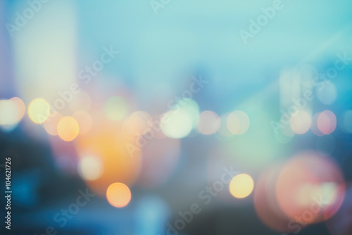 abstract background with bokeh defocused lights and shadow from cityscape at night, vintage or retro color tone photo