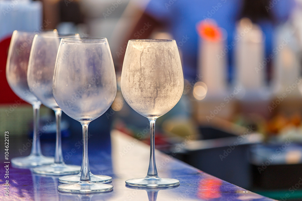 Empty glasses for wine on the table at counter bar from rooftop and restaurant , selective focus Empty glasses for wine on the table at counter bar from rooftop and restaurant , selective focus