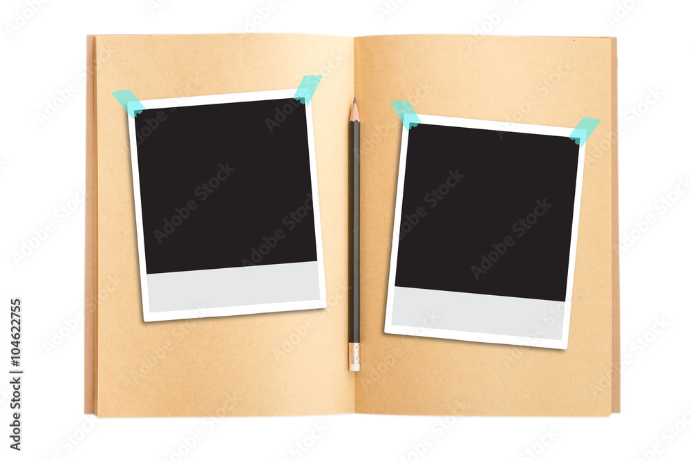 Polaroid photo frames on notebook and pencil Polaroid photo frames on notebook and pencil