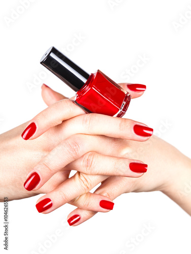 Red nail polish in a hands