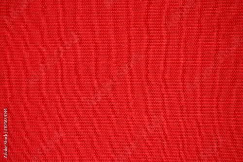texture of a piece of red wool small knit