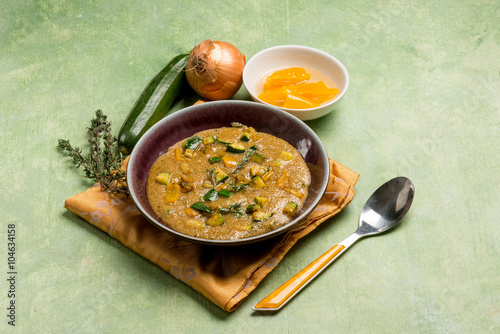 amaranth porridge with zucchinis and pepper photo