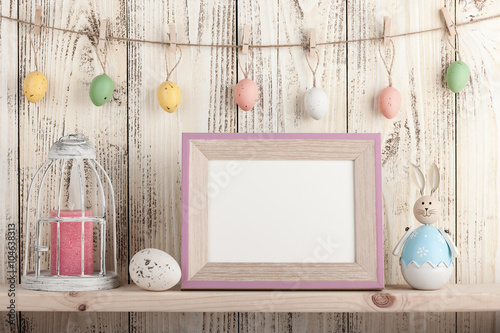 Easter decoration with blank wooden frame