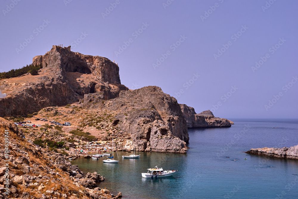 Harbor and medieval fortifications atop a rock in Lindos.