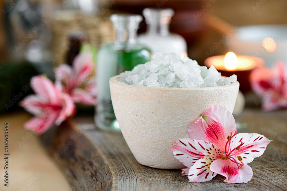 Spa setting decorated with purple flowers