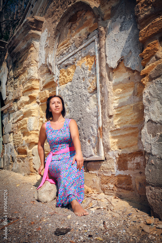 woman with long violet dress posing outdoor © liandstudio