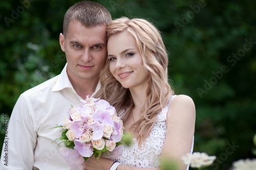 blond bride and groom in nature