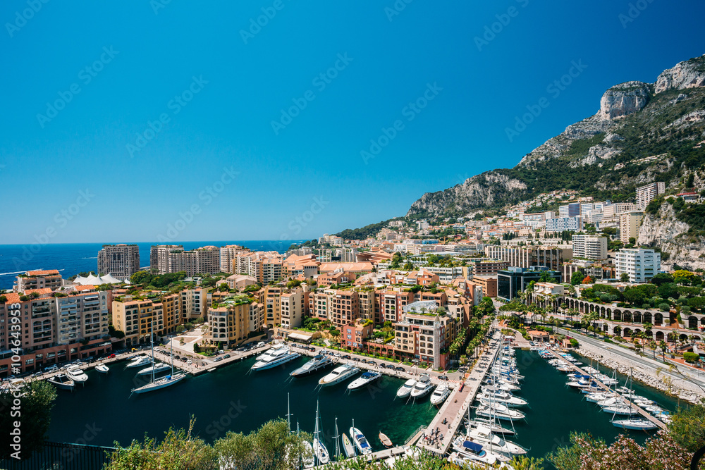 Yachts moored near city Pier, Jetty In Sunny Summer Day. Monaco,